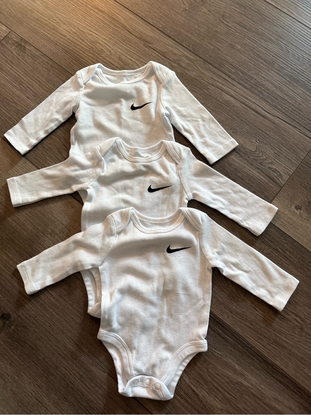 Nike White Long-Sleeve Baby Bodysuits with Black Swoosh - Pack of 3